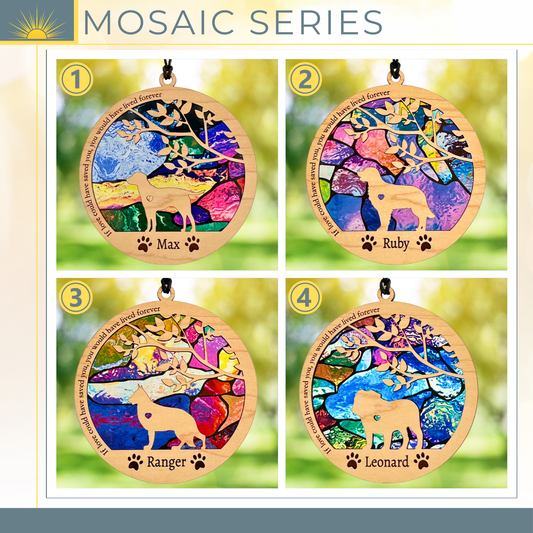 Four colorful mosaic pet memorials with names engraved on a blurred green background.